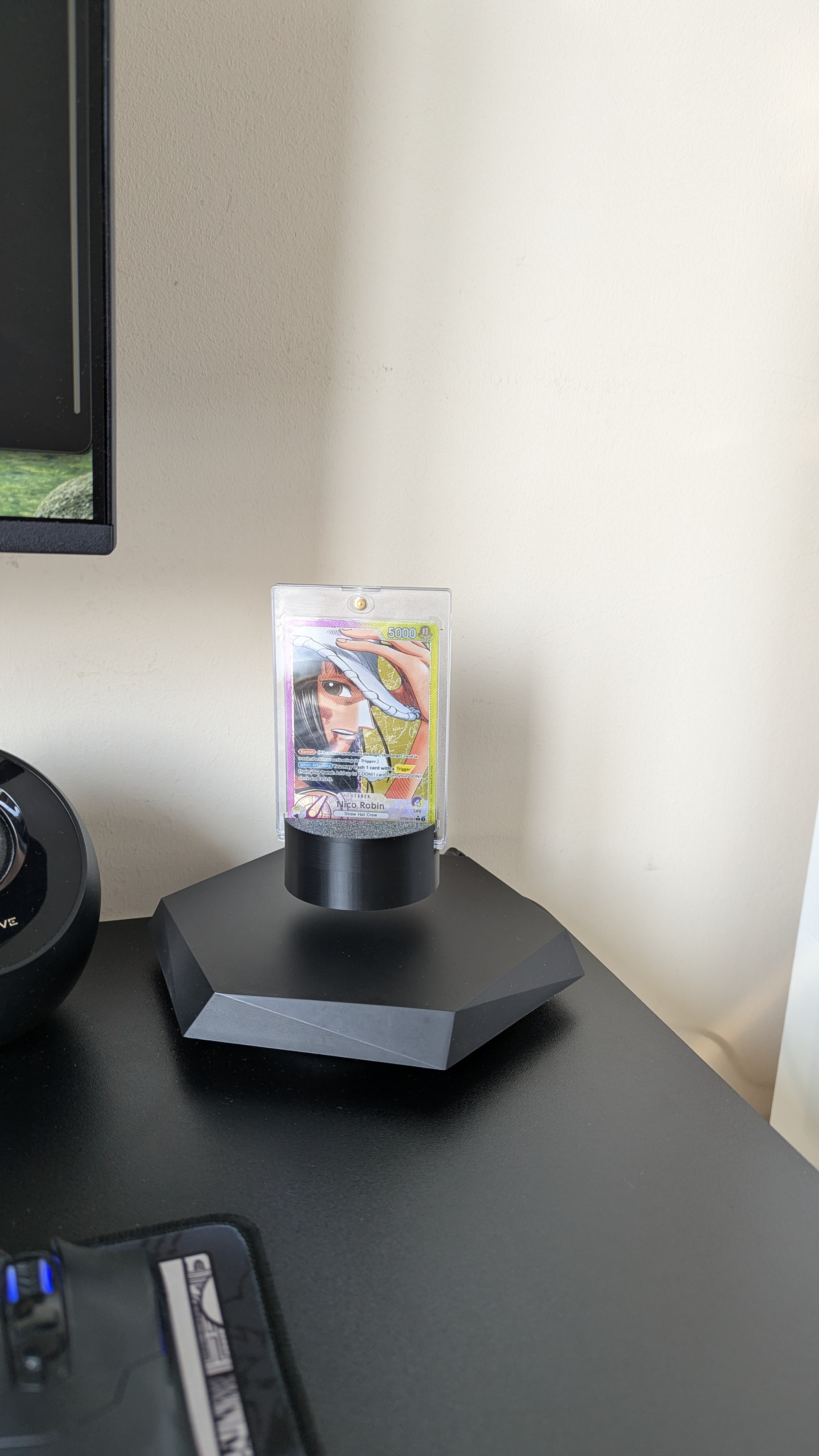 Card in a magnetic case on the Polaris TCG stand